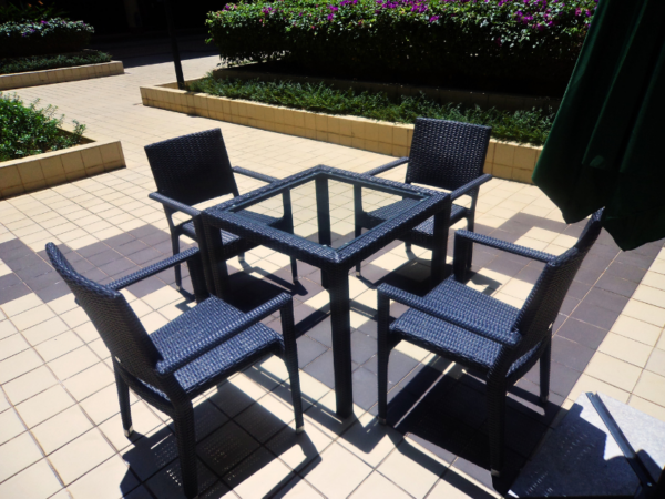 PANAMA OUTDOOR DINING TABLE features a sturdy aluminum frame, ensuring stability and longevity. The table is adorned with Rehau fiber woven around the frame